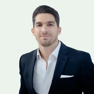 Portrait of Marcus Bell, a sales rep, in a dark suit