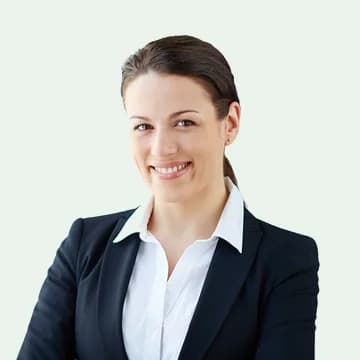 Portrait of Elena Marsh, the office HR lead, in a dark blazer