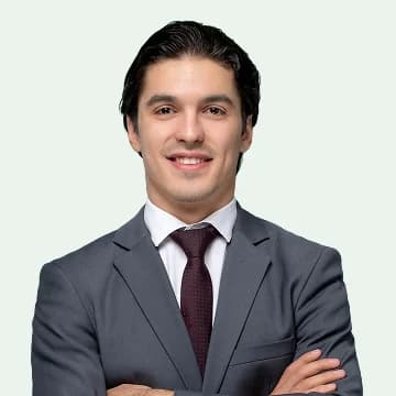 Portrait of Diego Alvarez, a sales rep, in a suit and tie