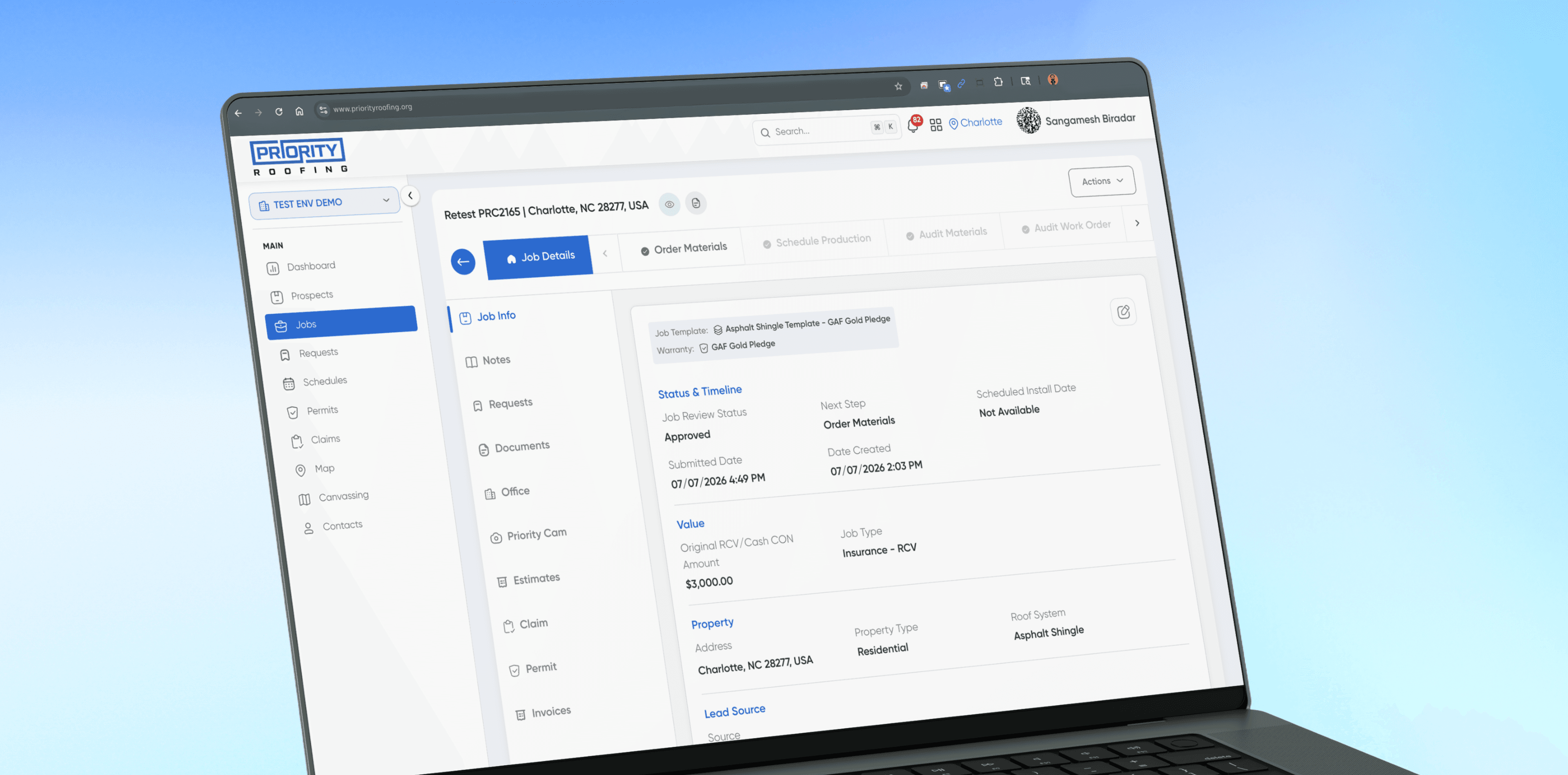 The Priority Roofing CRM job list on a laptop, showing customers, job types, statuses, and sales reps
